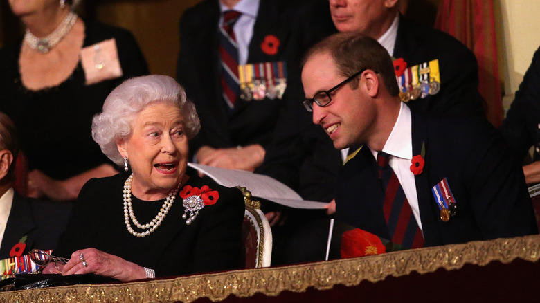 Queen Elizabeth II talking to Prince William