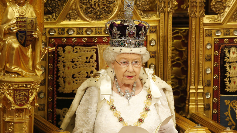 Queen Elizabeth II on throne in full regalia