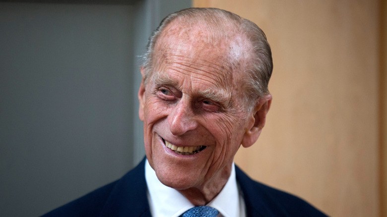 Smiling Prince Philip in blue tie