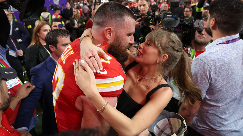 Taylor Swift and Travis Kelce hugging