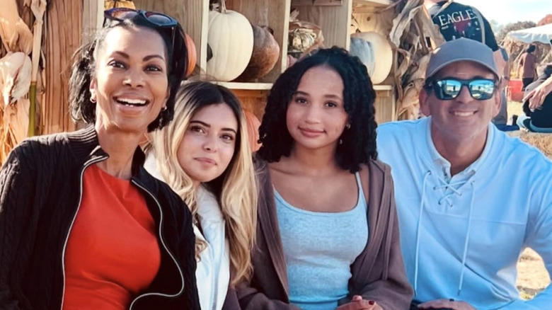 Harris Faulkner with her husband and their two daughters