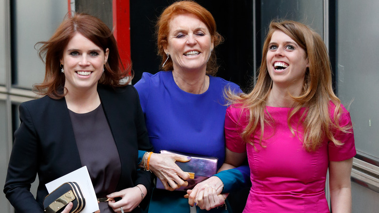 Princess Eugenie, Sarah Ferguson, and Princess Beatrice laughing