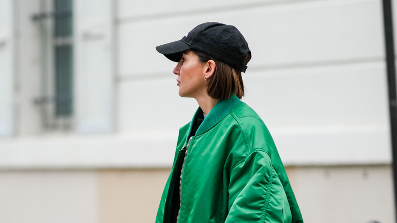 Minimalist baseball cap on short-haired woman