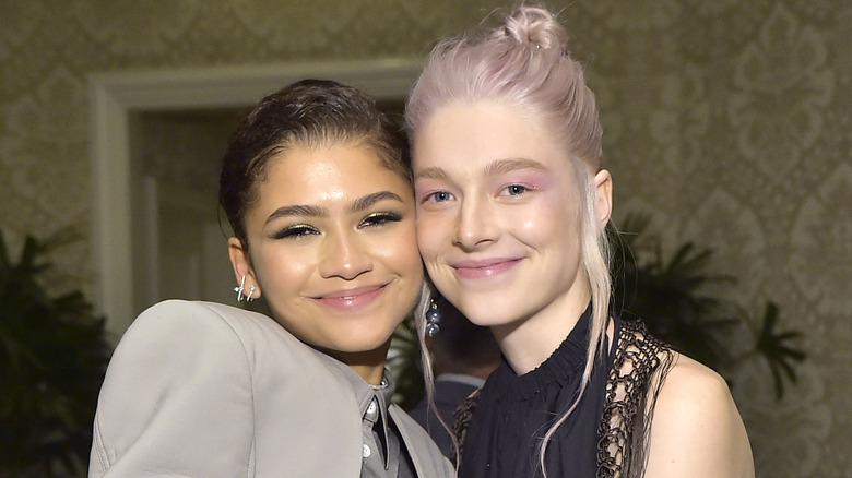 Zendaya and Hunter Schafer pressing heads, smiling