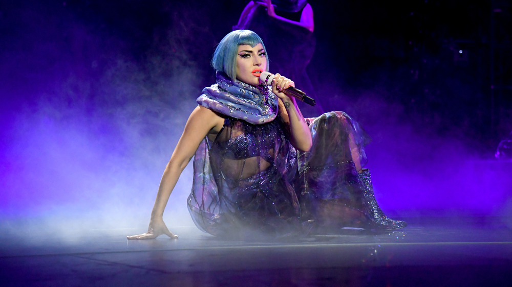 Lady Gaga performing in a short blue wig 