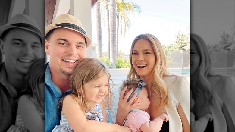 Darin Brooks and Kelly Kruger smiling with their daughters