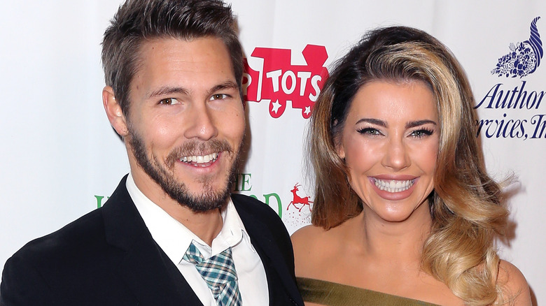 Jacqueline MacInnes Wood and Scott Clifton posing on the red carpet
