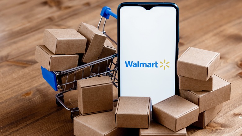 Phone with Walmart logo surrounded by mini boxes