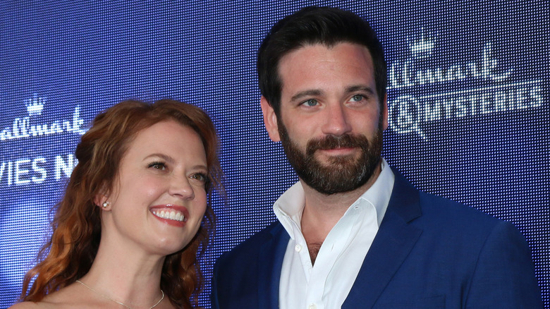 Colin Donnell and Patti Murin posing on red carpet