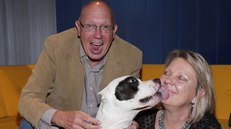 Dann Florek and Karen Florek with a dog