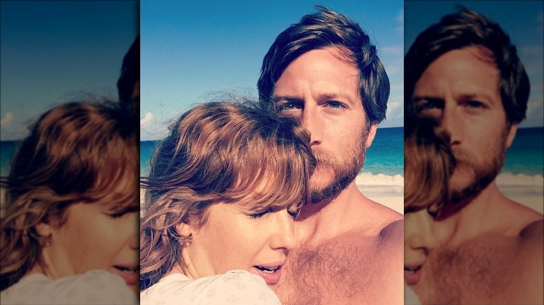 Kelly Reilly, her husband embracing