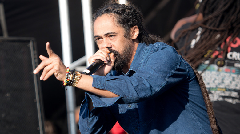 Damian Marley sings into microphone