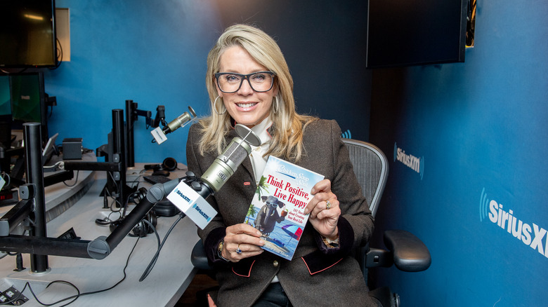 Deborah Norville holding book