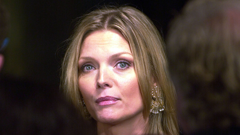 Michelle Pfeiffer against a black background