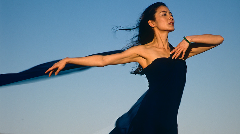 Michelle Yeoh dancing in black dress