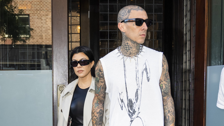 Kourtney Kardashian and Travis Barker walking together