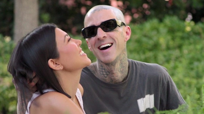 Kourtney Kardashian and Travis Barker, laughing