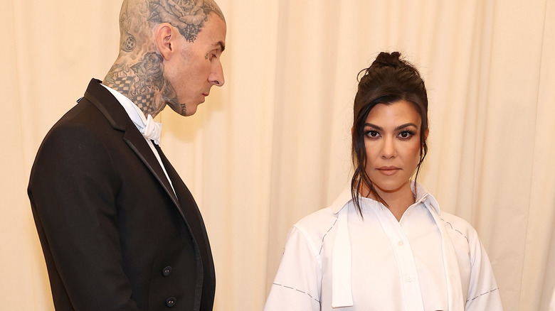 Travis Barker staring at Kourtney Kardashian