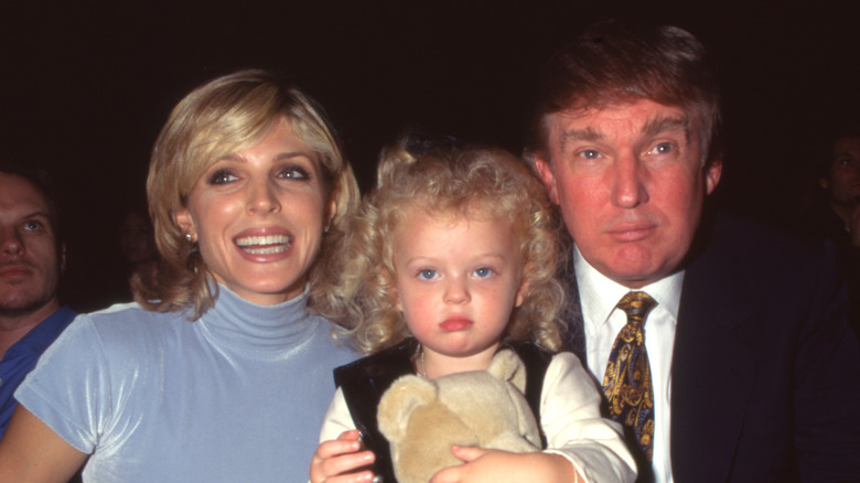 Marla Maples smiling with Tiffany Trump and Donald Trump