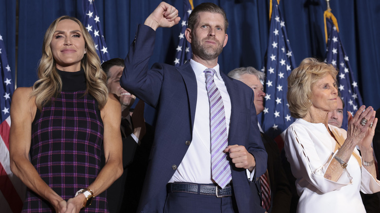 Eric Trump fist-pumping on stage with Lara