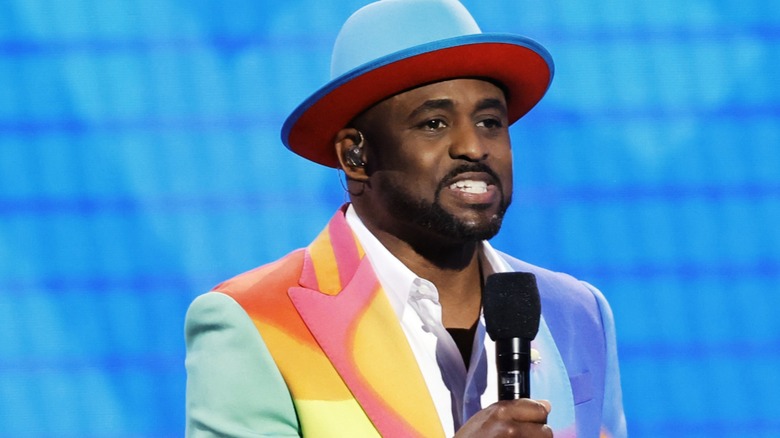 Wayne Brady in a colorful suit