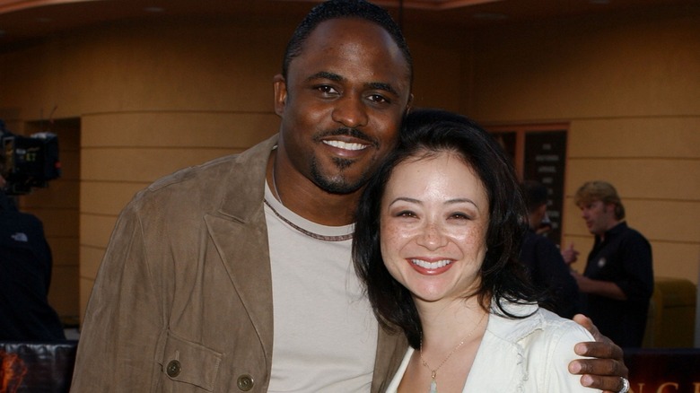 Wayne Brady smiling with Mandie Taketa