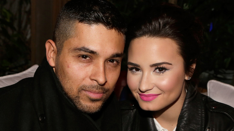 Wilmer Valderrama and Demi Lovato posing