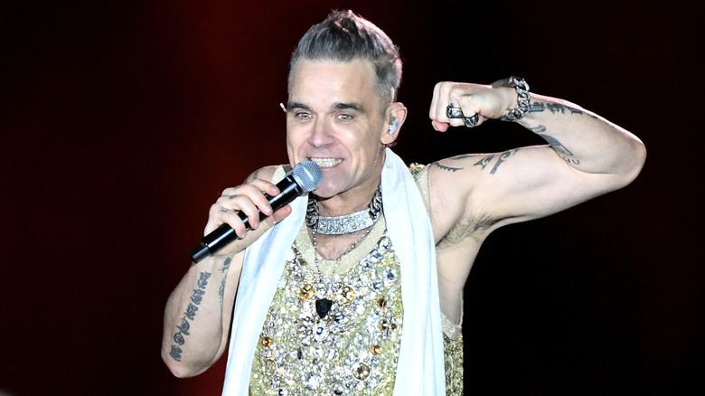 Robbie Williams performing onstage