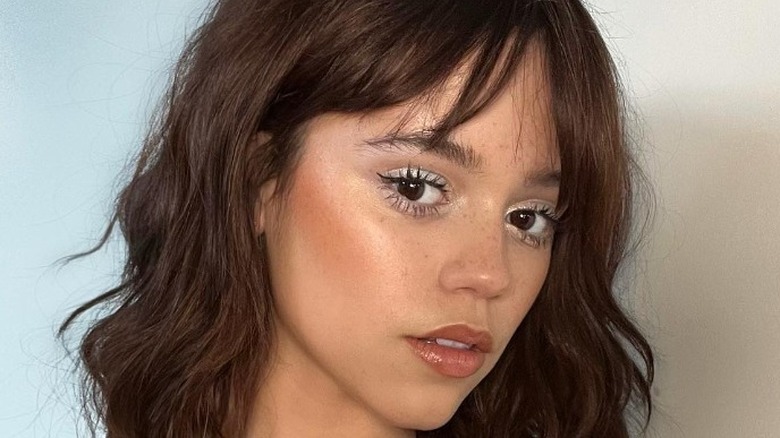 Jenna Ortega looking up at an angle