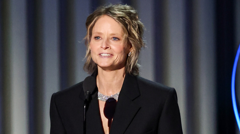 Jodie Foster standing in front of microphone