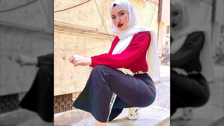 Haneen Hossam in white hijab and red shirt