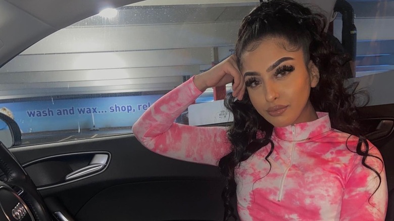 Mahek Bukhari posing in car