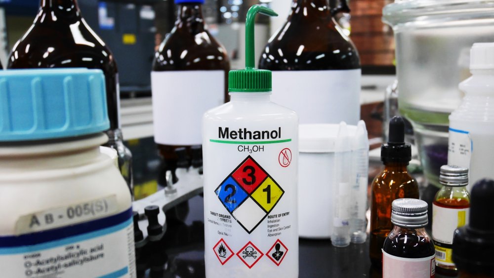 Methanol in a bottle with warning signs 