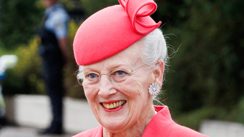 Queen Margrethe II in red hat