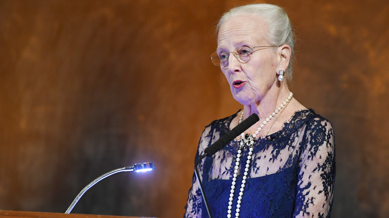 Queen Margrethe II speaks at podium