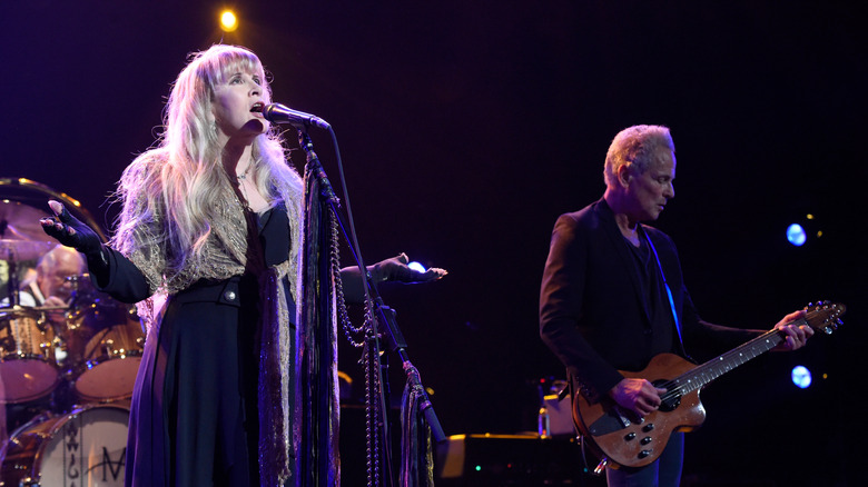 Stevie Nicks and Lindsey Buckingham performing on stage