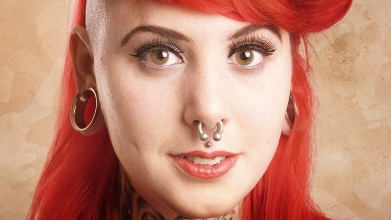 woman with red hair and piercings