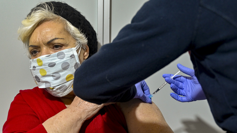 Woman gets a dose of the Moderna vaccine