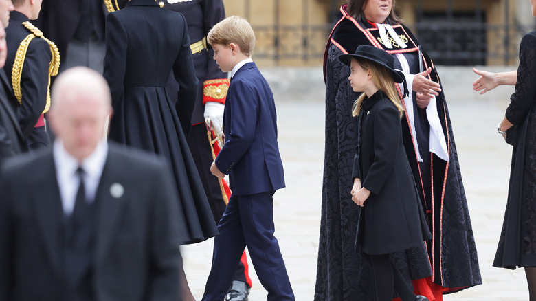 Prince George and Princess Charlotte enter Westminster Abbey