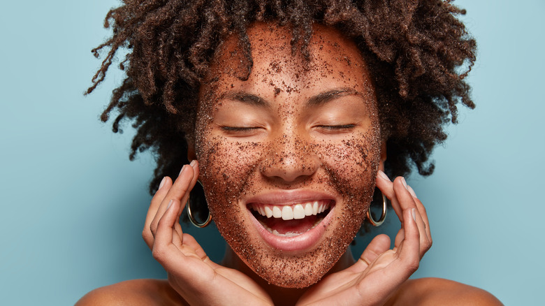 woman with face scrub mask