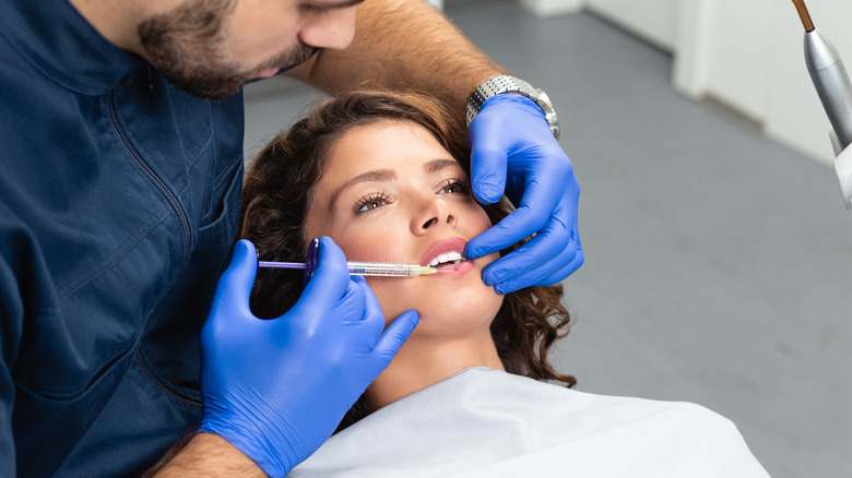 woman getting lip injection