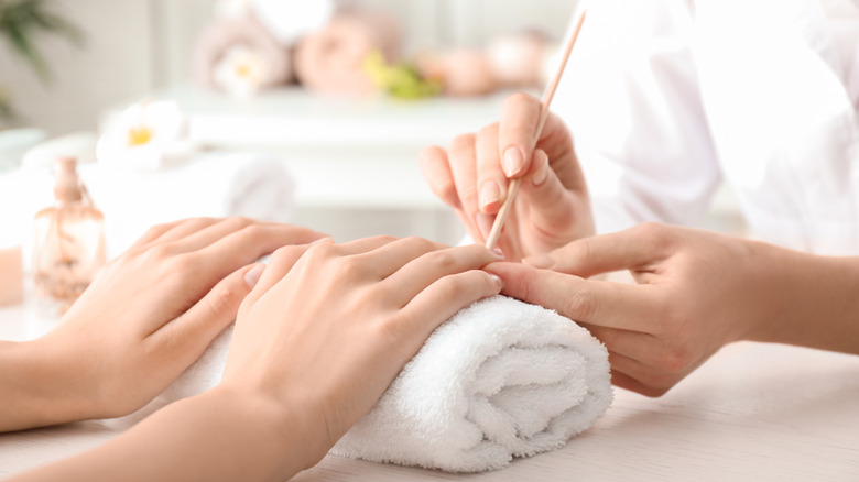 Woman getting her nails done