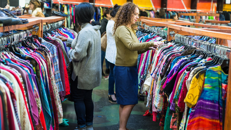 Browsing clothing at thrift store