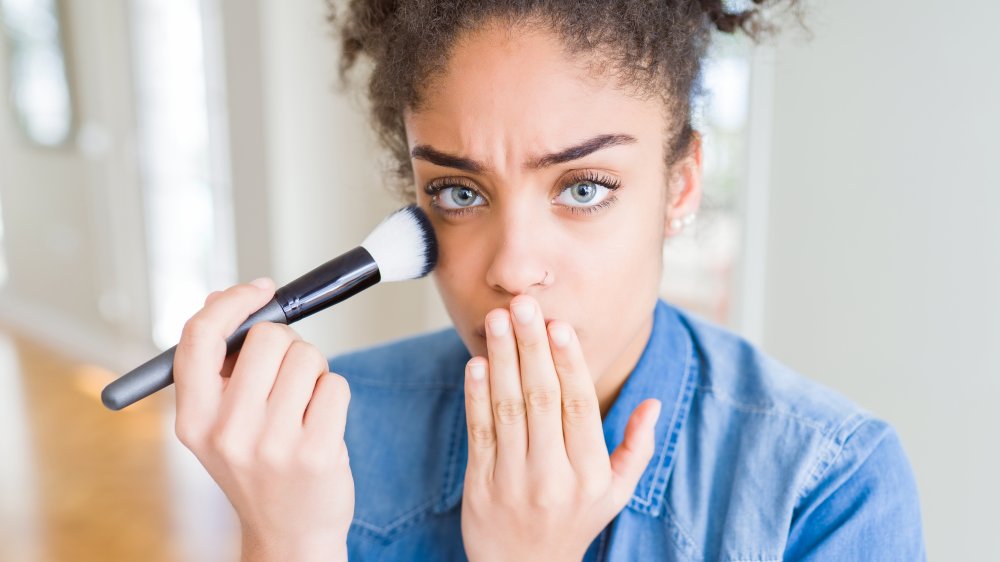 woman with makeup brush