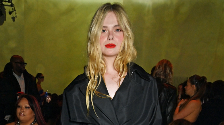 Elle Fanning posing at Paris Fashion Week