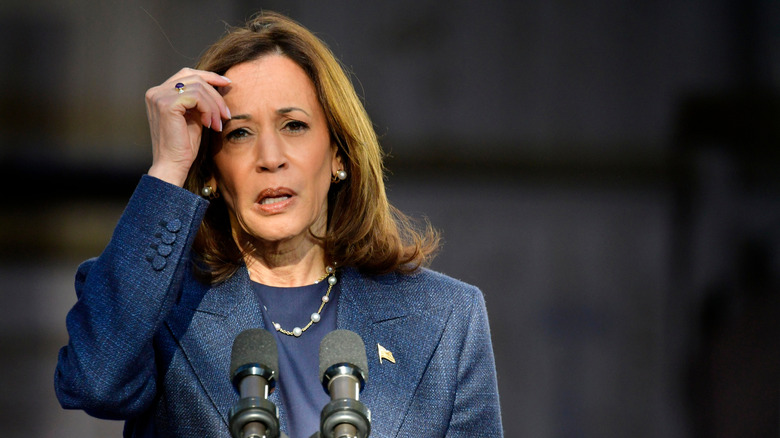 Kamala Harris looks worried at podium