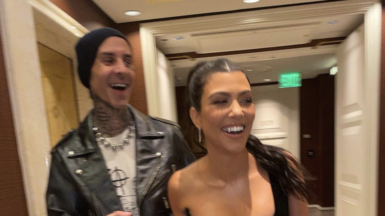 Travis Barker, Kourtney Kardashian laughing