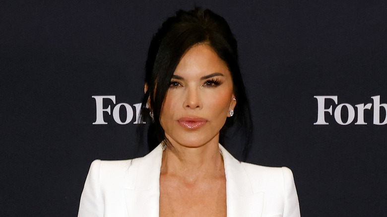 Lauren Sanchez posing for the camera while wearing white