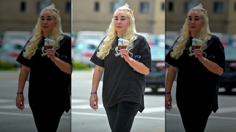 Amanda Bynes walking with Starbucks