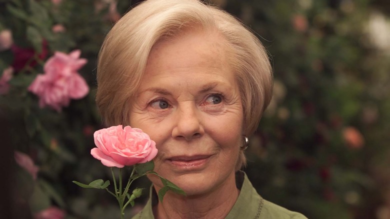 Katharine Duches of Kent holding a rose 